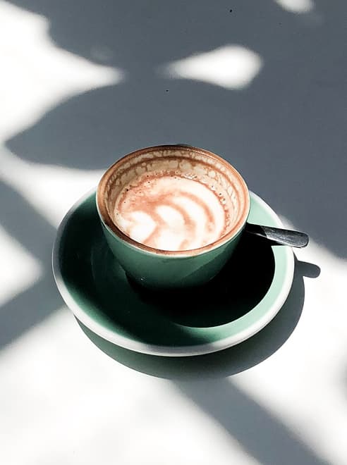 a cappuccino in a cup and saucer