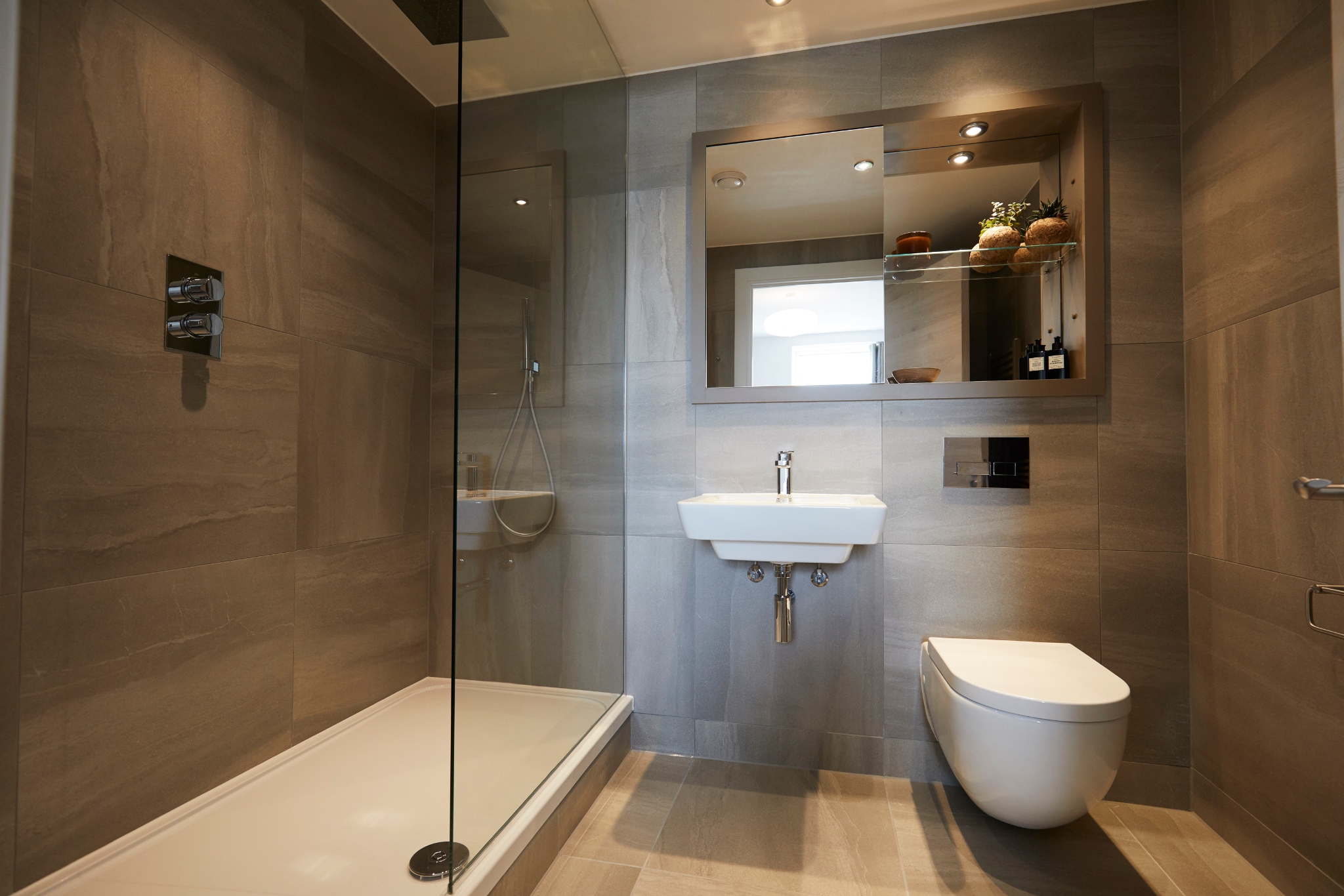 bathroom, shower, sink and toilet