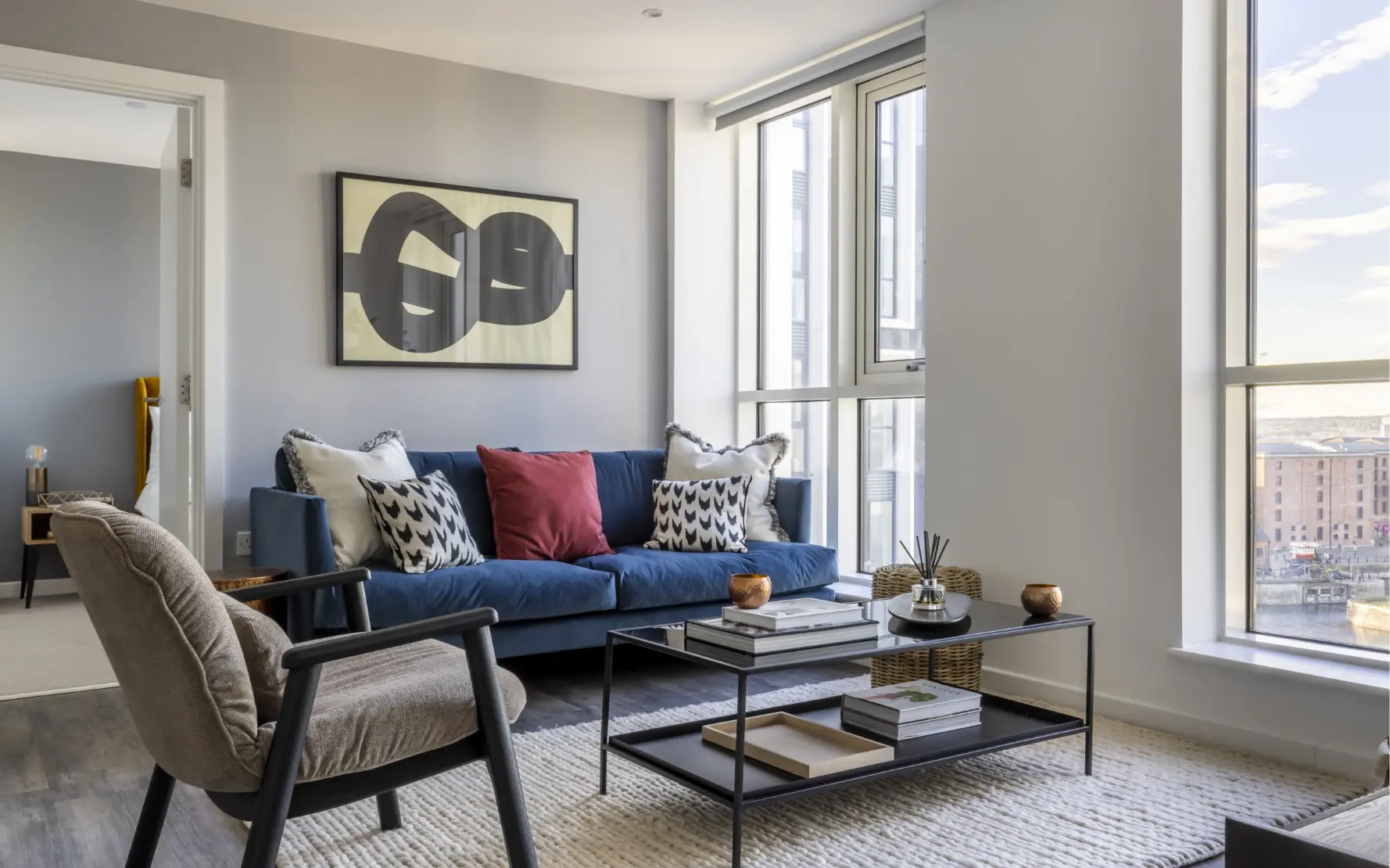 beautiful lounge, chairs and couch, artwork on wall