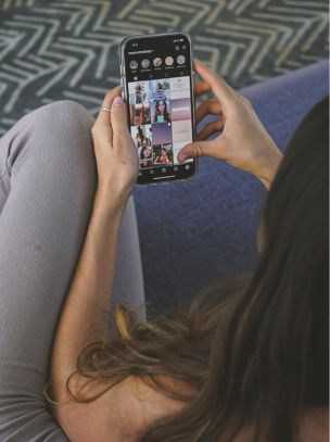 Someone scrolling on their phone